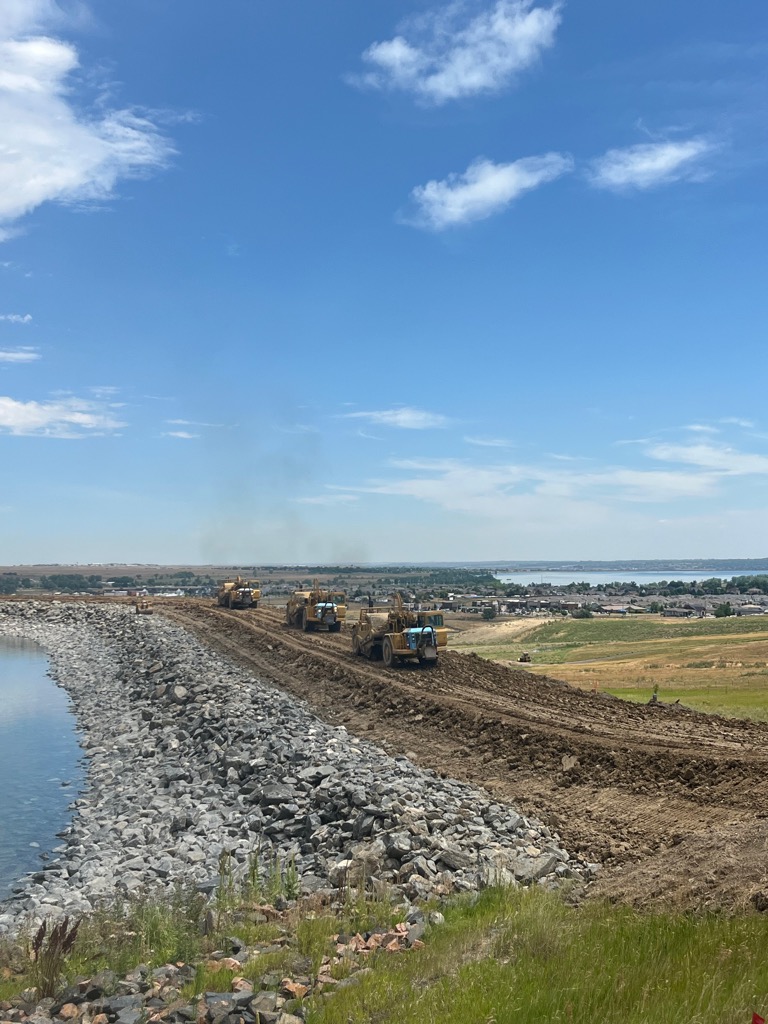 Aerial nighttime view of Welton Reservoir expansion construction equipment and earthwork