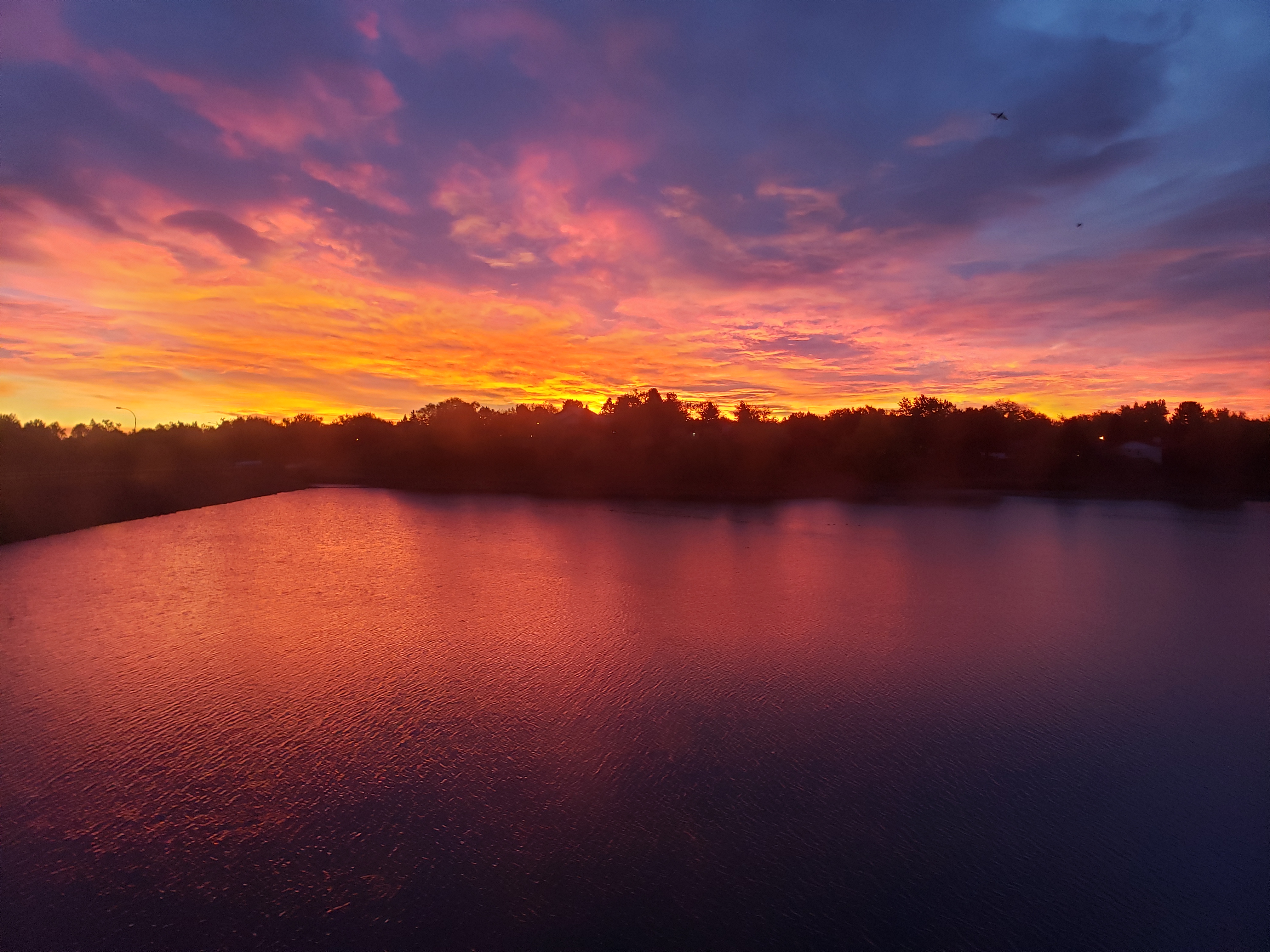 Reservoir at sunset, representing CMWC's modern era from 2000 to present